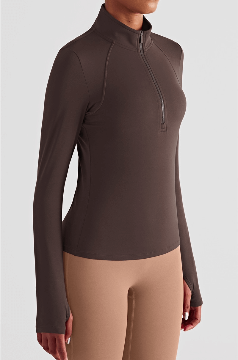 Women's brown long sleeve fitness sweatshirt with finger cut-outs, featuring a zip-up front for athletic comfort.